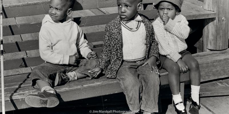 Three little kids on a park bench in Sausalito, California, 1962